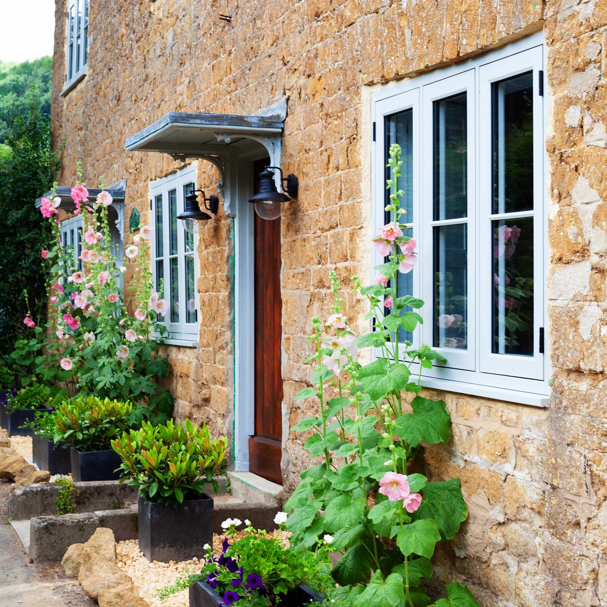 Residence 9 Golden Oak style flush windows on a cottage approach