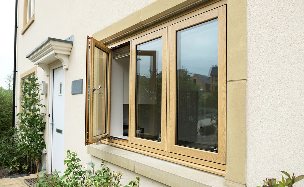 VEKA / Timeless Golden Oak flush sash window shown open