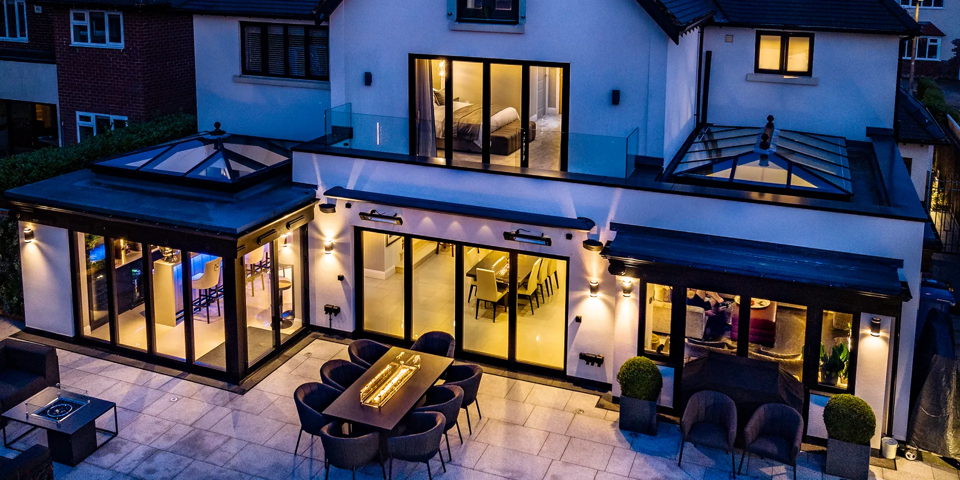Modern home extension with Decalu aluminium windows and glazed doors at dusk