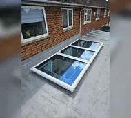 Flat glass rooflight on a flat roof extension