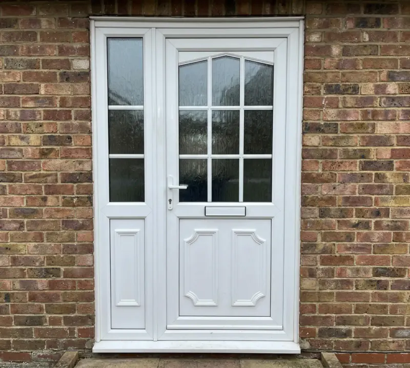 White uPVC front door with a glazed panel