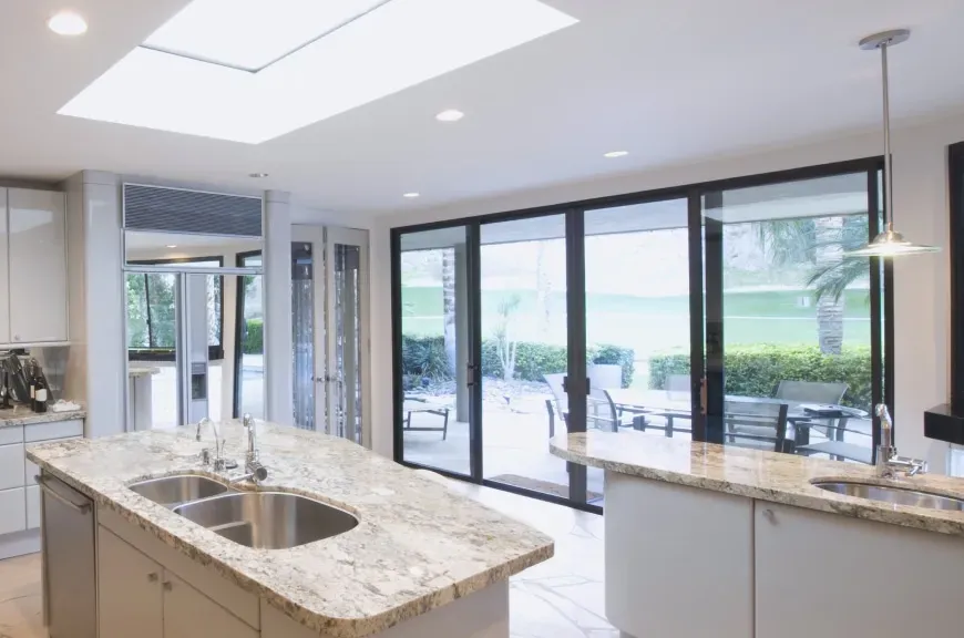 Patio doors opening to a garden